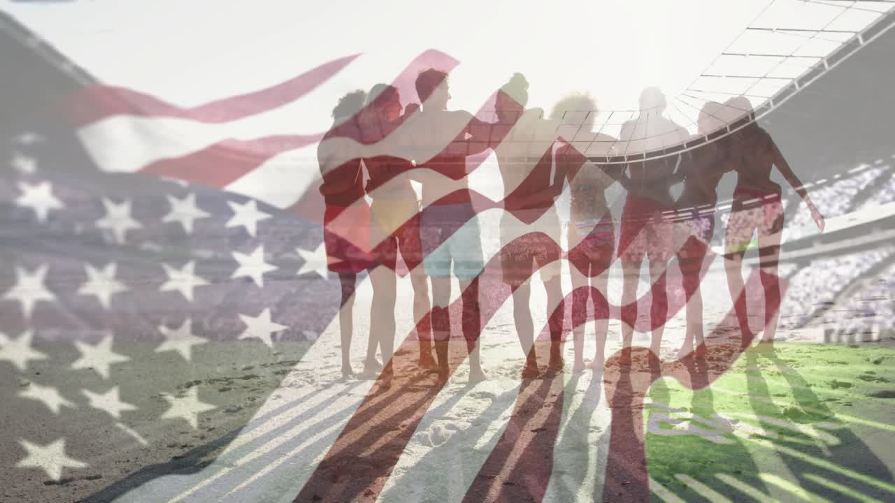 Flag overlay waving, eight teammates arm-in-arm showing unity on sand stepping forward over stadium
