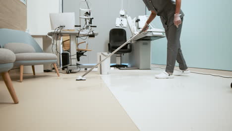 female cleaner mopping the floor