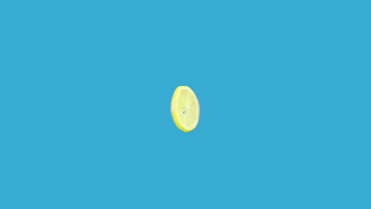 Lemon slice spinning around in loop motion | Premium Stock Video Footage