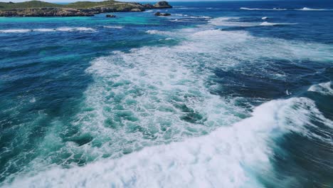Aerial-view-above-waves,-in-the-coast-of-Rottnest-Island,-Australia--orbit,-drone-shot