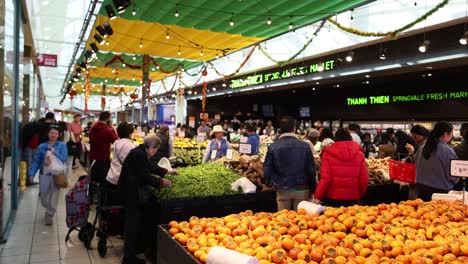 shoppers browse fresh produce at springvale market