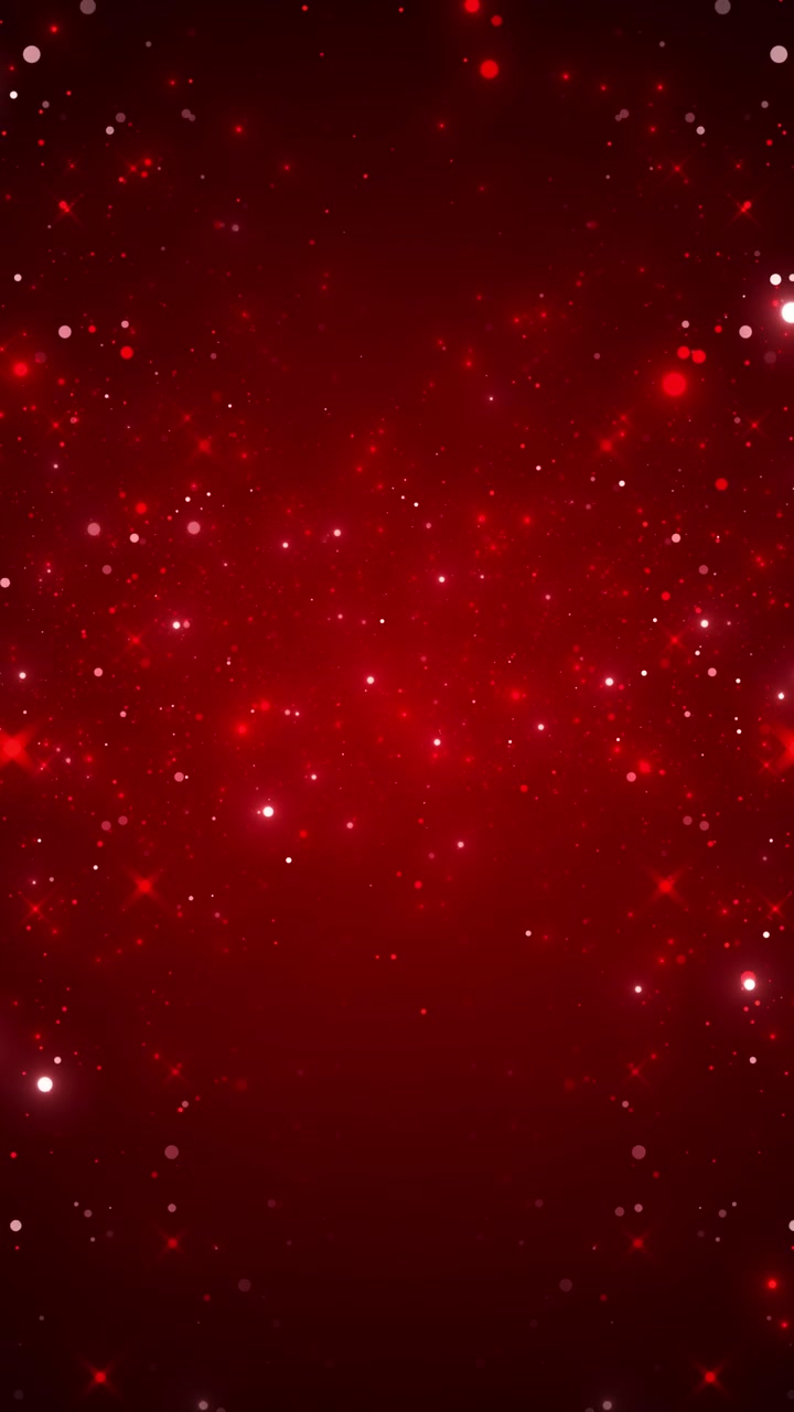 Sfondo rosso intenso glitterato con particelle fluttuanti, cerchi bokeh e bagliori scintillanti in un'atmosfera calda e festosa