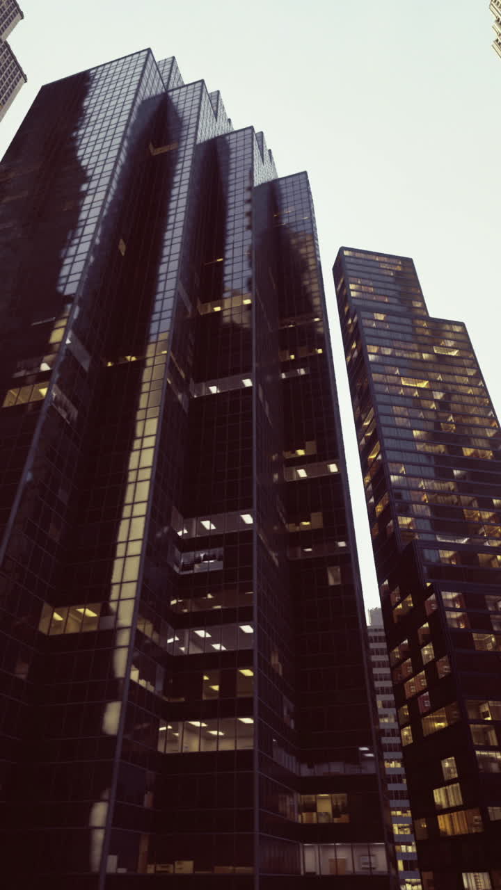 Urban skyscrapers towering against a twilight sky in a bustling city