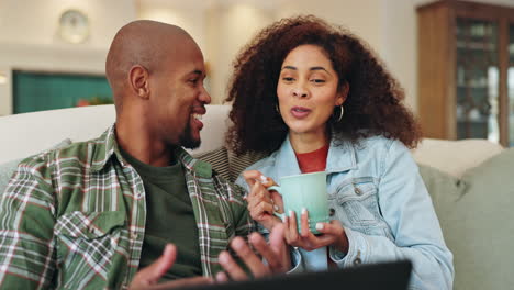 couple relaxing at home with laptop