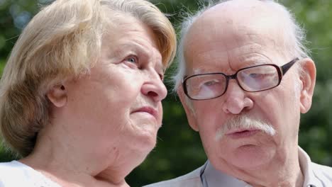 close-up portrait of an elderly couple outdoors