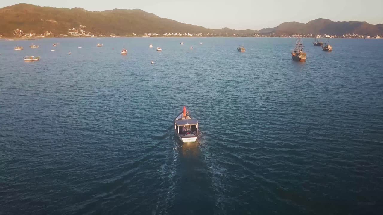 Aerial view over the coastline of Florianopolis, Croatia. Boat arriving into the bay