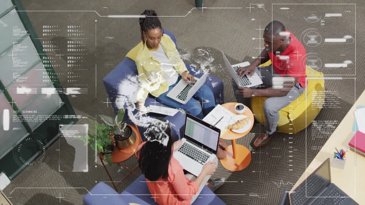 Top view of diverse people working on laptops, data processing animation over them