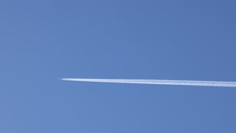 jet plane flying, leaving a chemical trail