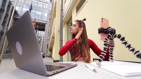 young woman doing a video call outdoors