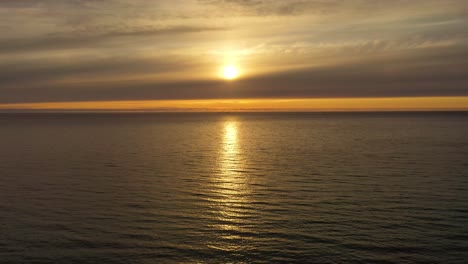 Aerial-view-of-a-beautiful-sunset-over-the-sea.-Beach-Lofoten-archipelago,-Norway.