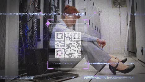 Animation-of-interference,-qr-code,-fingerprint-and-data-over-woman-working-in-server-room