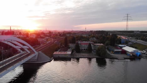 aerial shot of train bridge on motława river in gdansk, poland