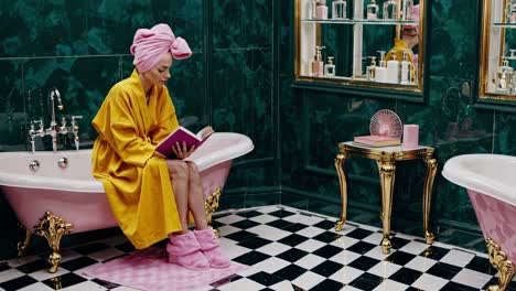 woman reading in a luxurious bathroom