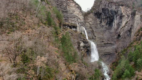 aerial-view-traveling-in-over-the-Sorrosal-waterfall-in-the-province-of-Huesca-on-a-sunny-day