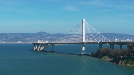 Cinematic-drone-shot-of-The-Bay-Bridge-connecting-San-Francisco-to-Oakland