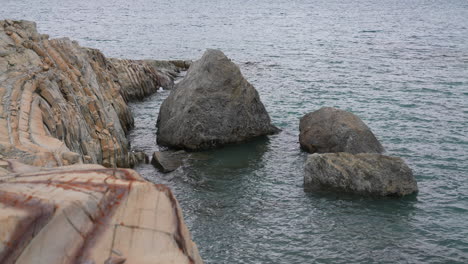 Limestone-Rocks-and-Layered-Hills-on-Coastline-of-Greenland