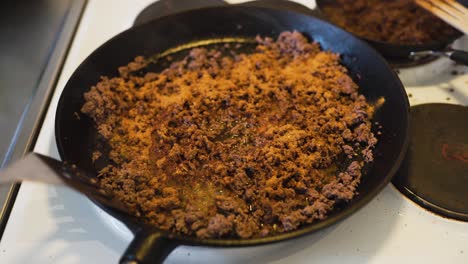 putting some water on hot ground beef covered in taco spice-1