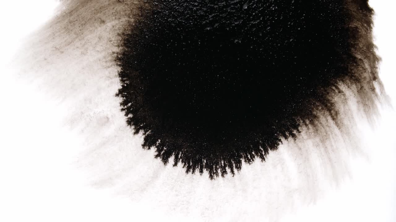 Black Ink Drops On White Background