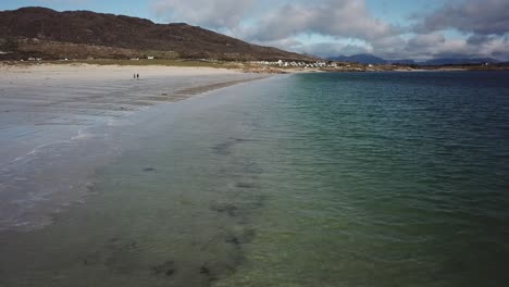 aerial-view,-push-in,-sandy-beach-and-the-atlantic-ocean-shore,-Connemara,-Ireland