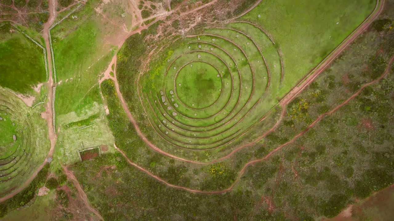 Aerial close up view of terraced circular depressions of Moray, Peru.