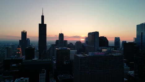 aerial of chicago skyline with pink sunset - drone 4k