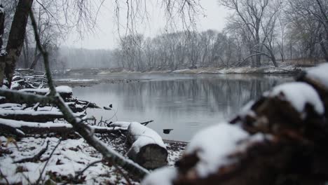 snowfall on michigan river during winter