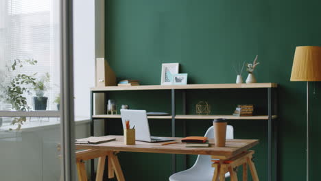 modern home office with green wall