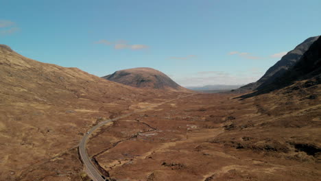 Drone-footage-of-Glencoe-valley-in-Scotland-with-the-A82-winding-between-the-mountains