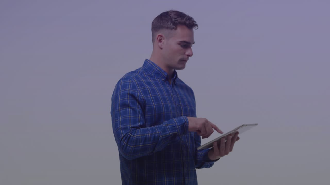 Man holding tablet tapping screen and activating tech UI, showing graph right globe analyzing data
