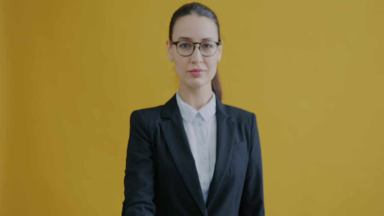 Woman in Business Suit Pointing