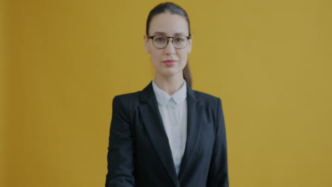 woman in business suit pointing