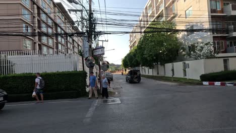 vendor cart moves through urban streetscape