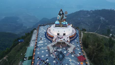 aerial rising drone overview of lord shiva statue in pumdikot nepal