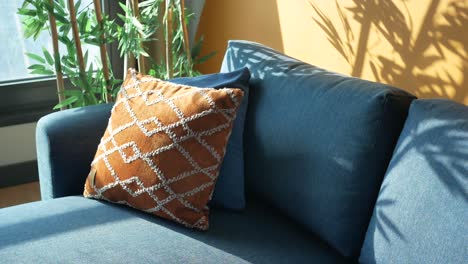 cozy living room with blue sofa and decorative pillows