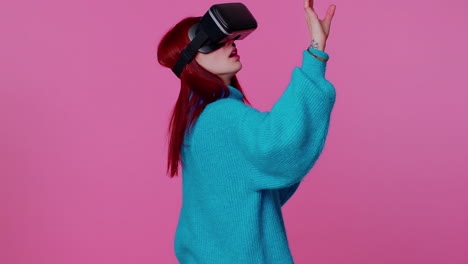 Girl-using-virtual-reality-futuristic-technology-VR-headset-helmet-to-play-simulation-3D-video-game