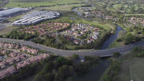 scenic cheltenham drive crossing mudgeeraba creek in the suburb of robina in gold coast, queensland