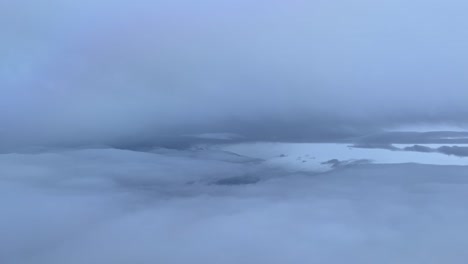 Flying-trough-winter-snow-clouds,-from-a-cockpit