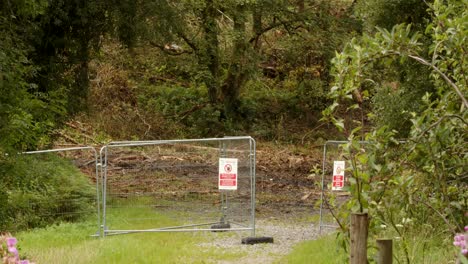 Wide-shot-of-Path-closed-signs,-informing-people-of-felling-infected-trees-with-larch-disease-on-the-Rhyslyn-forest-road-in-the-Afan-Valley