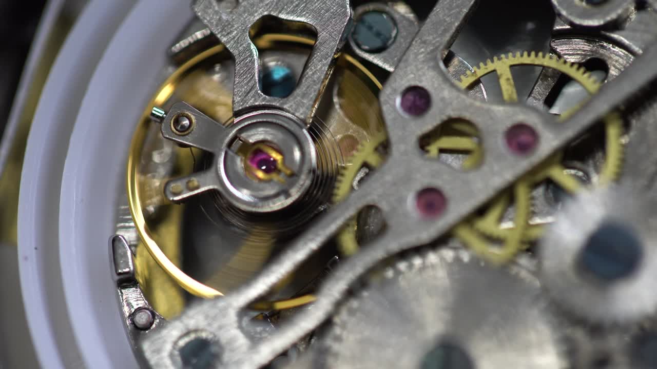 old pocket watch mechanism working, close up view
