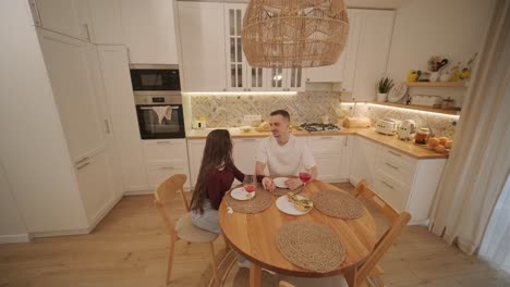 loving couple making a sandwich in kitchen-living room