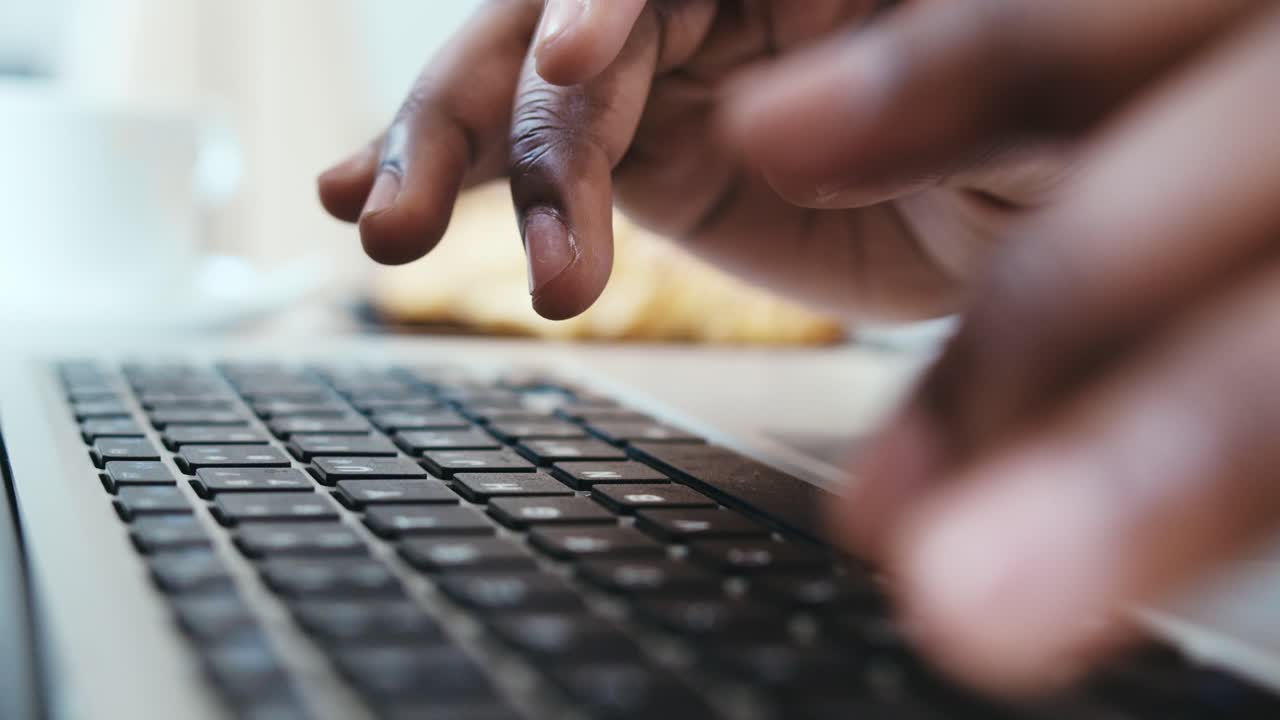 Person Typing on Laptop