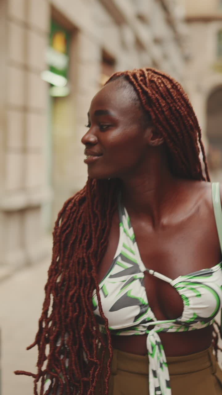 Woman with dreadlocks in the city