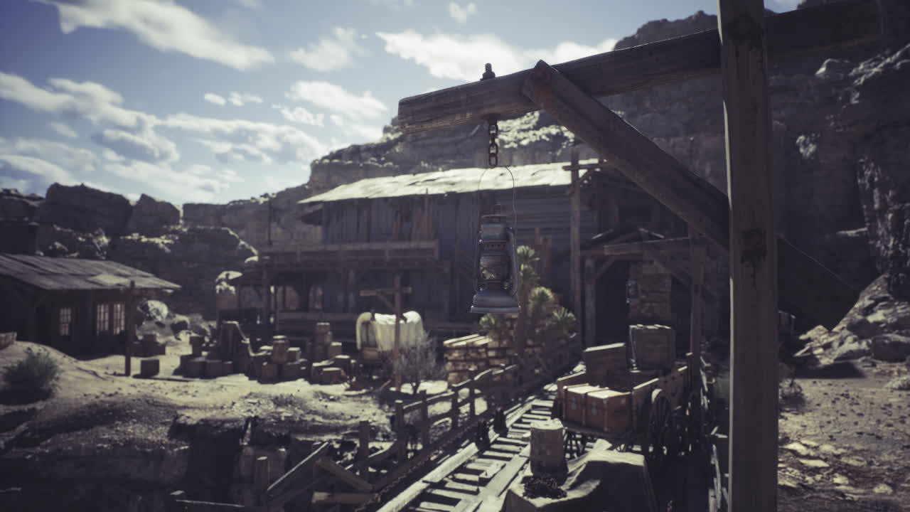 Abandoned mining town nestled in rocky landscape under a cloudy sky