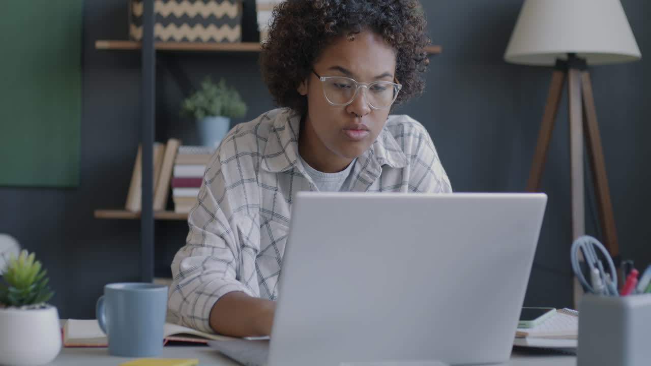 Young Woman Working From Home on Laptop