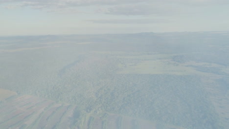 smoke of forest fire passing by drone camera revealing landscape of transition pantanal- amazonian region in brazil