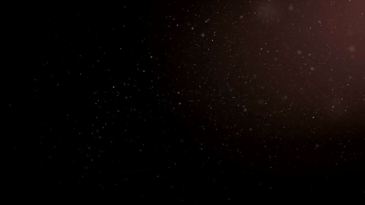 fliegende organische staubpartikel auf schwarzem hintergrund