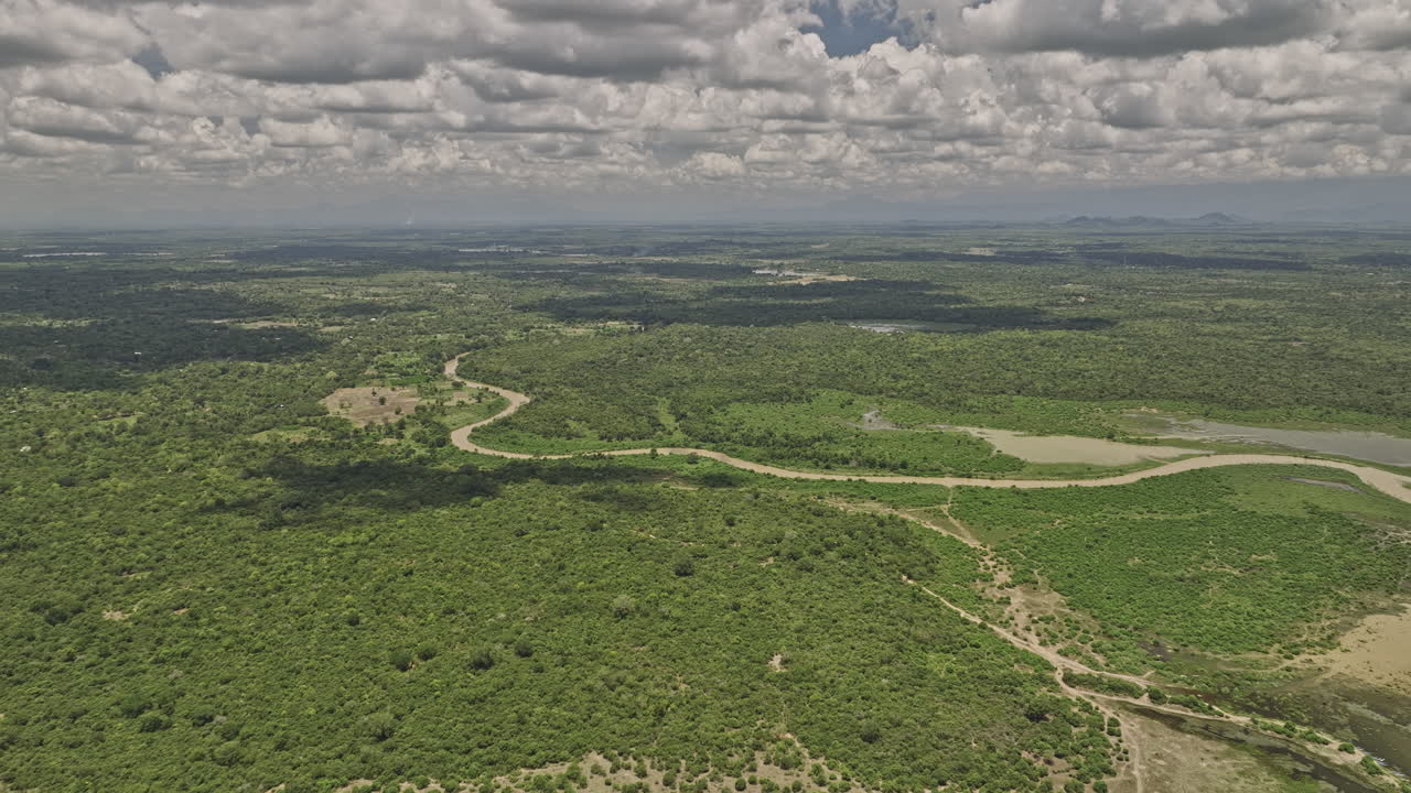 Bogahawewa Sri Lanka Aerial v3 flyover Lunugamvehera National Park's diverse ecosystems, lush shrublands, reservoir, Kirindi Oya river and wetlands vegetations - Shot with Mavic 3 Cine - April 2023