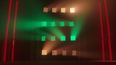 stage lighting with red and green beams