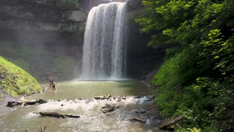 exploring a waterfall in the summer