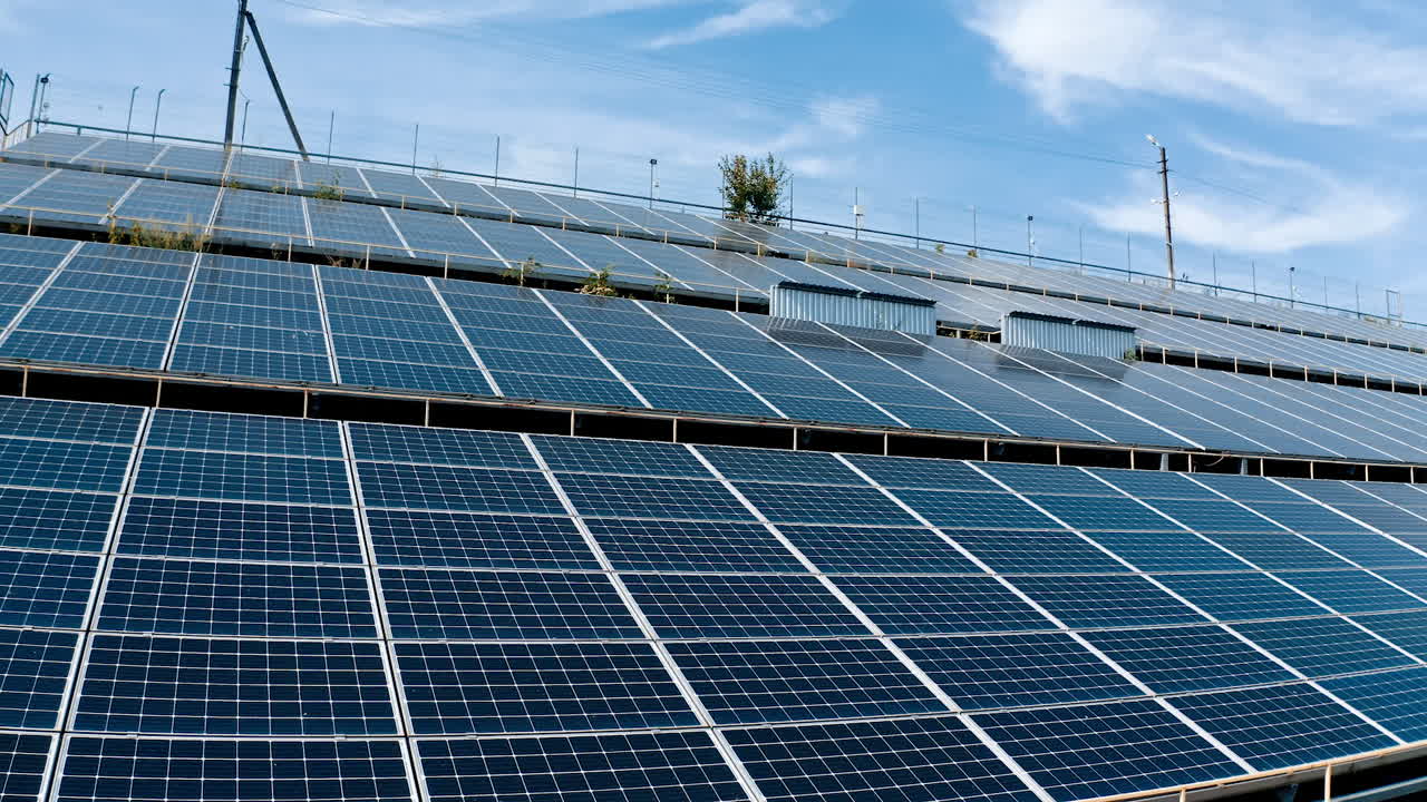 Photovoltaic infrared solar panels receiving photons from sun. Green clean energy on solar farm. Renewable energy. Solar panels on the ground at angle.
